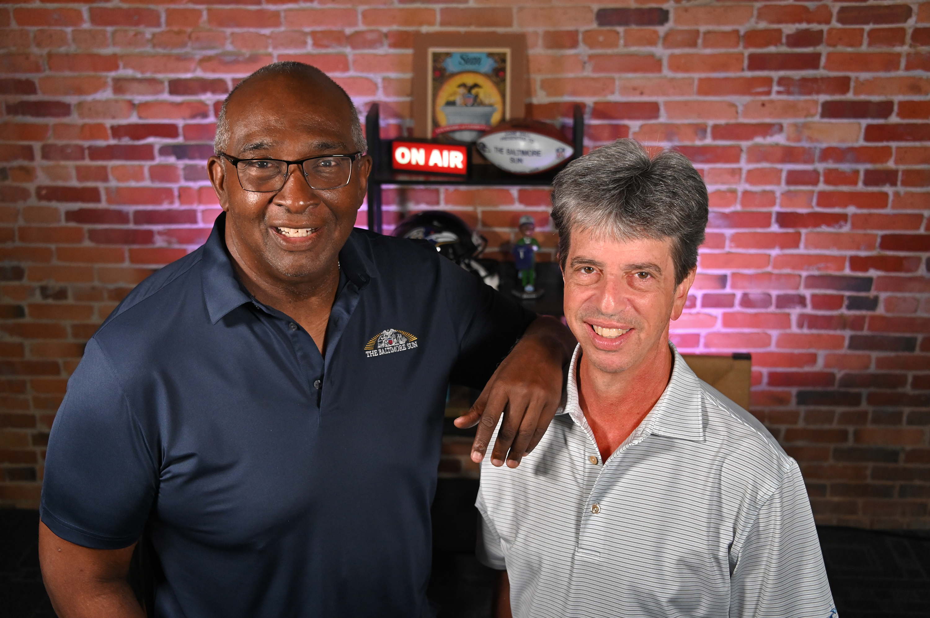Mike Preston and Jerry Coleman set up for the upcoming Ravens podcast. (Lloyd Fox/Staff)